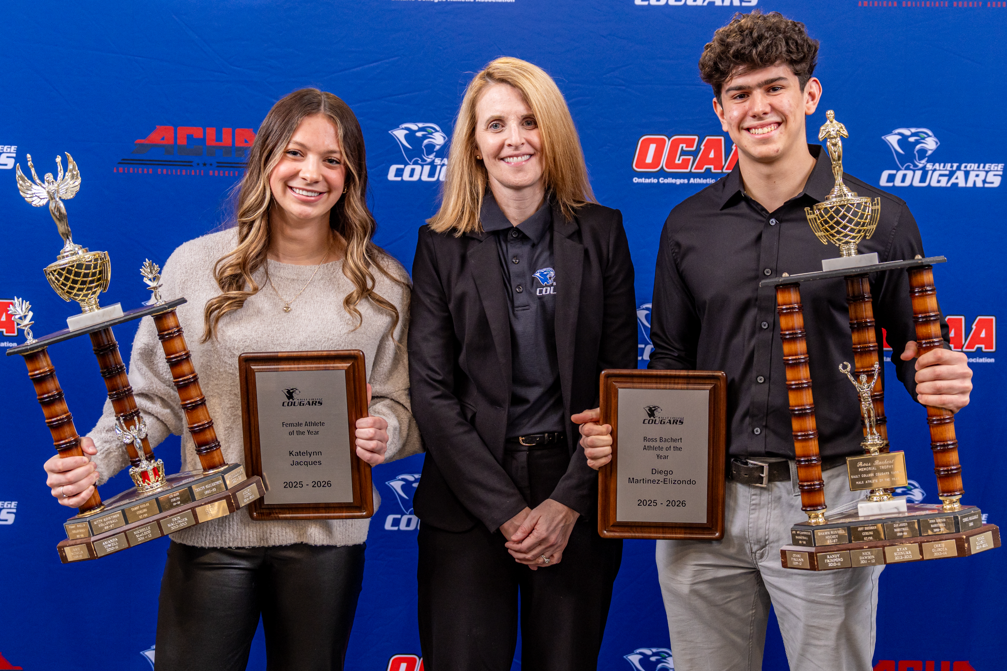 Katelynn Jacques and Diego Martinez-Elizondo celebrate their Athlete of the Year awards alongside Sault College President Sherri Smith