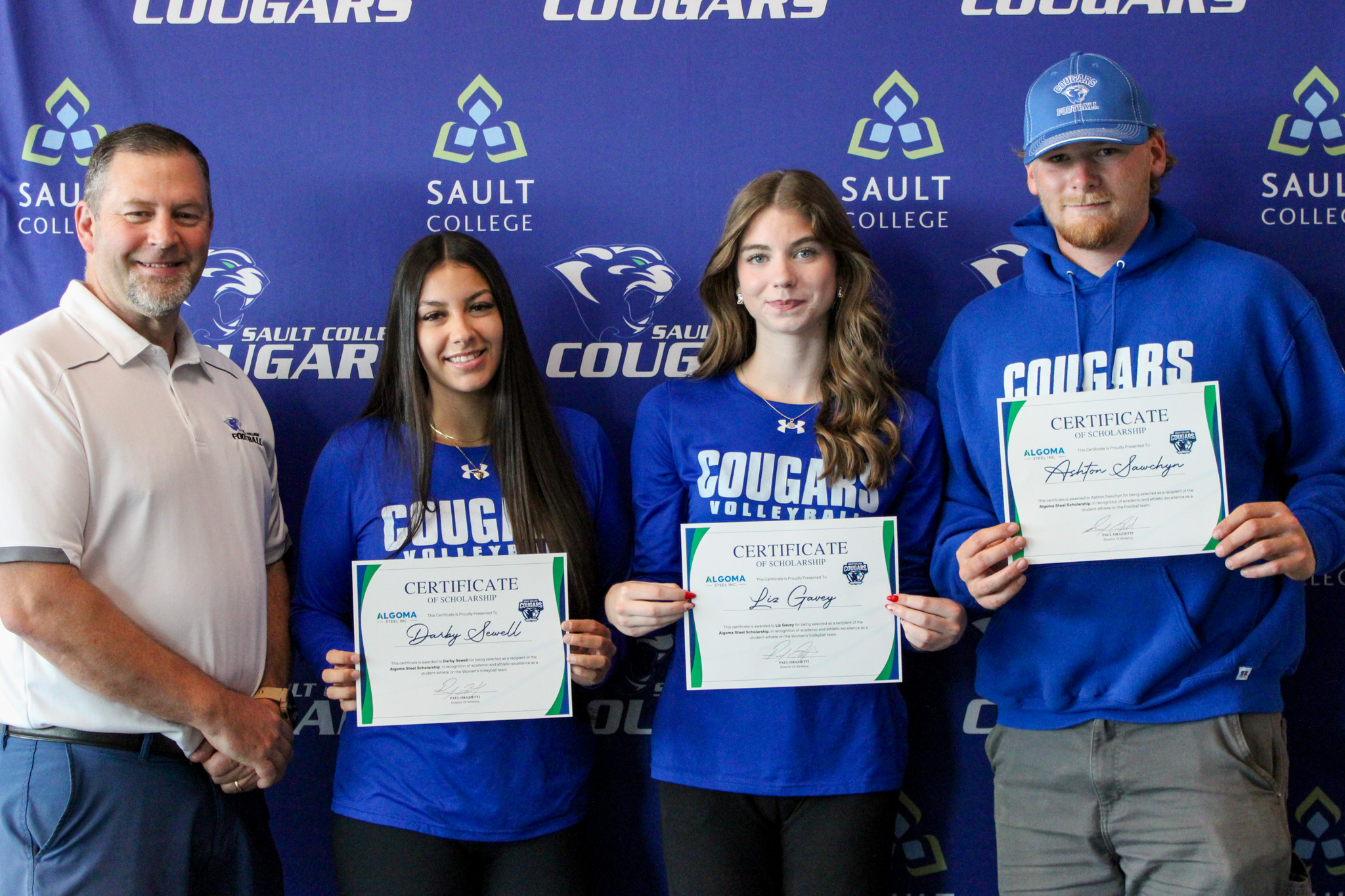 Director of Athletics, Paul Orazietti presents Algoma Steel scholarship certificates to Darby Sewell, Liz Gavey and Ashton Sawchyn (Photo: Emily Biasucci/Sault Cougars)